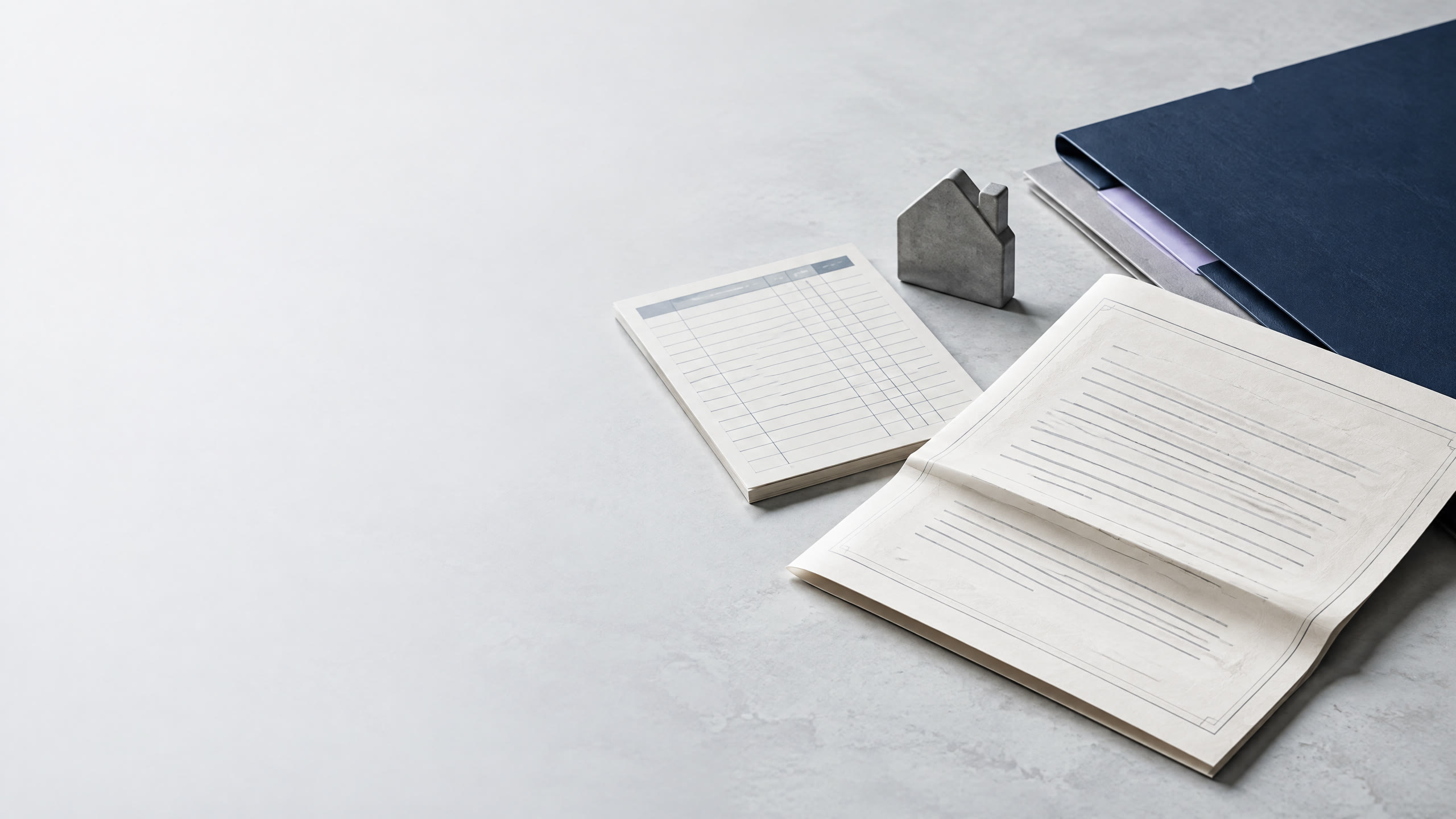 Editorial still life of a note file, payment ledger, and simplified real-estate collateral token.